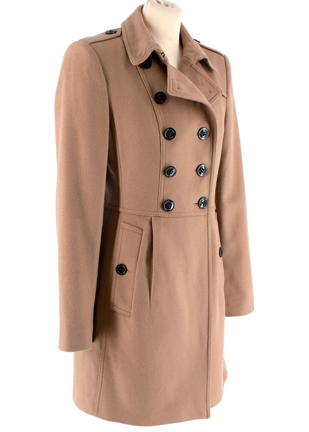 Burberry Camel Cashmere Blend Coat 

- Made of a luxurious soft cashmere and wool blend 
- Neutral camel hue 
- Classic double breasted cut 
- Button fastening ot the front
- Pleat details to the waist 
Buttoned cuffs 
- Pockets to the front 
-