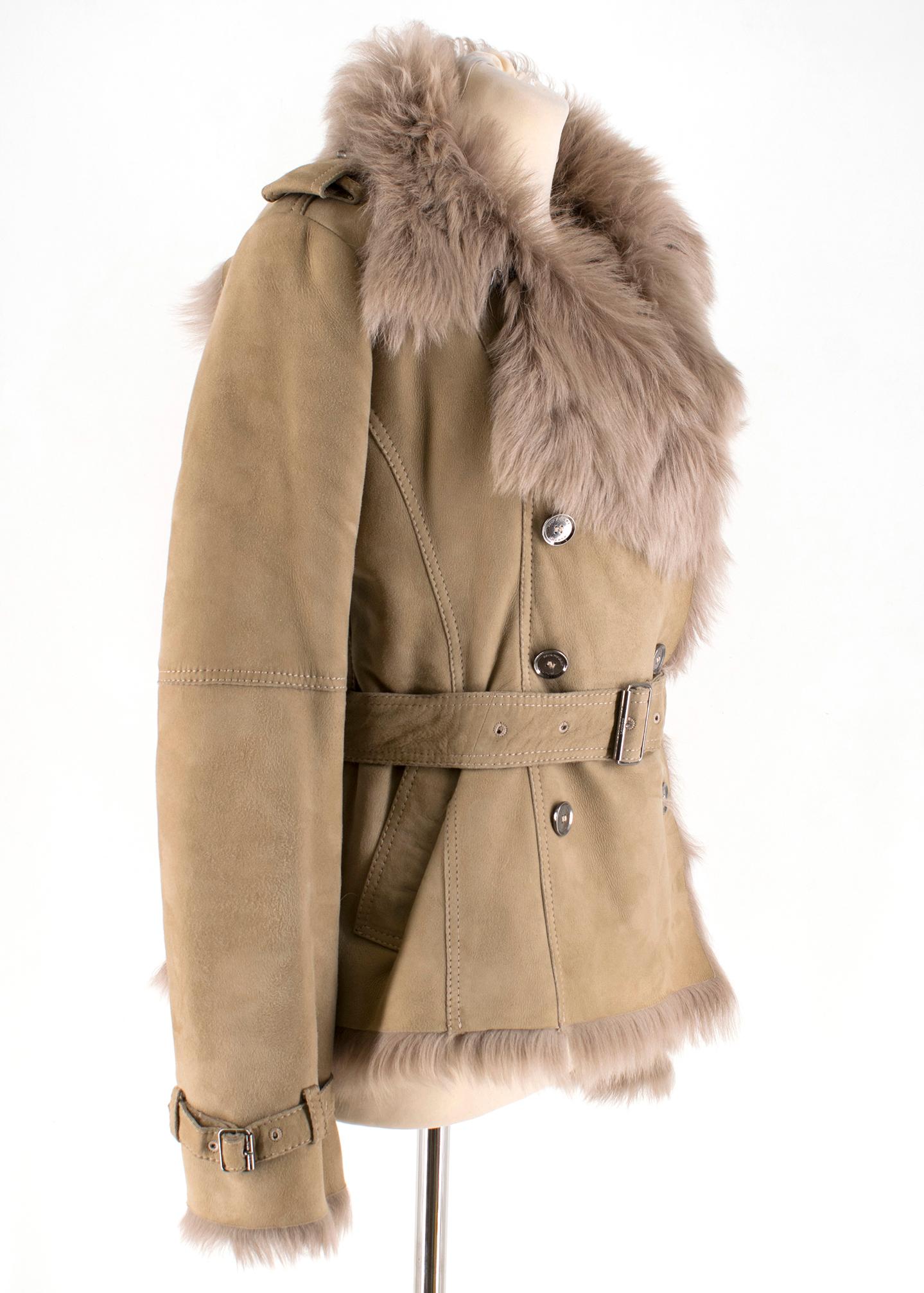 Burberry Camel Lamb Shearling Belted Jacket

Smooth brown suede jacket,
Soft shearling lining,
Long sleeves,
Double breasted jacket,
Adjustable belt tie with buckle fastening,
Buckle up cuffs,
Two front slant pockets,
Single back vent,
Features gun