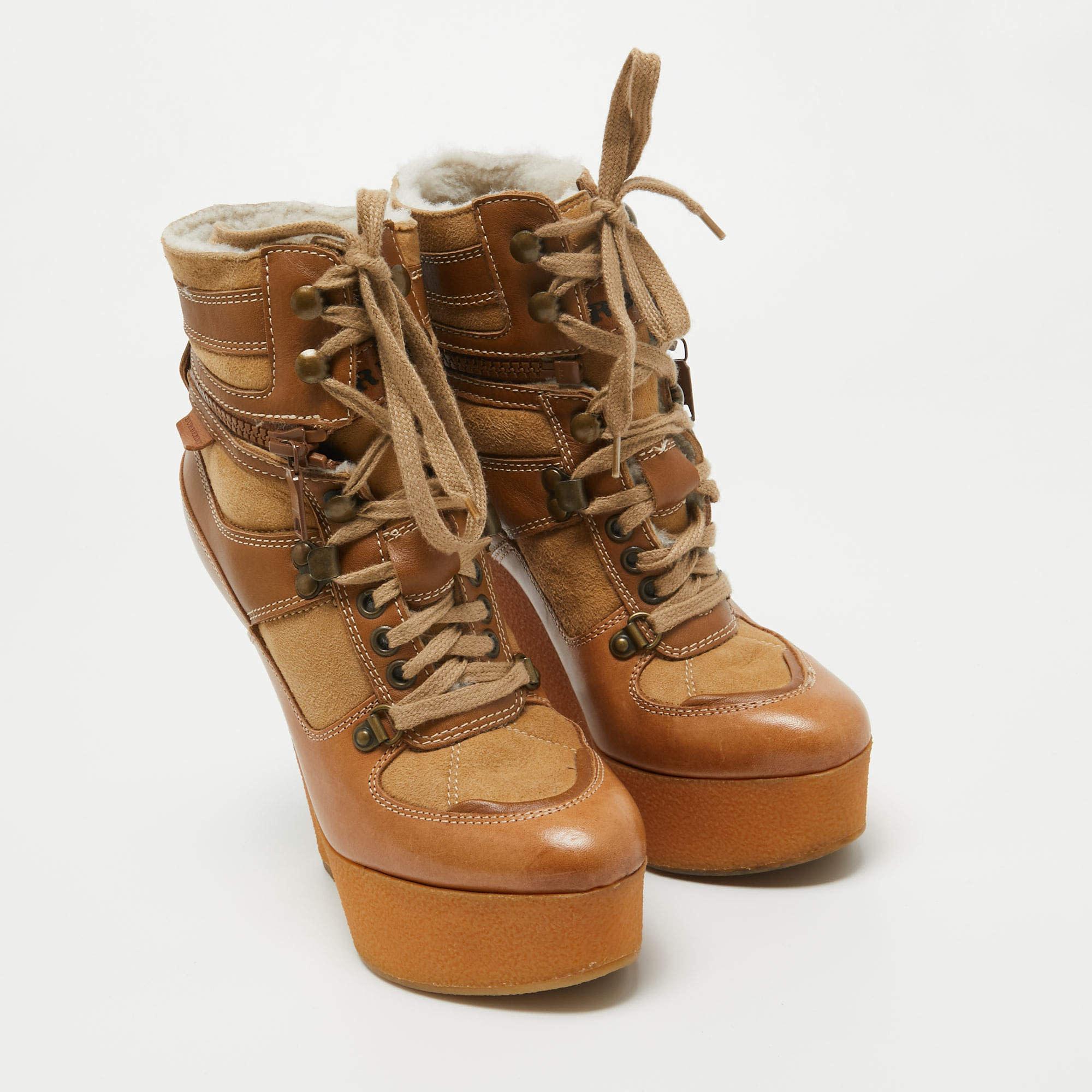 BURBERRY CAMEL LEATHER SHEARLING PLATFORM WEDGES (US 8)

Size: 8 US / EU 38.5
Color: Camel / brown
Material: leather / suede / shearling
Heel Height: 150 mm / 6”
Platform Height: 50 mm / 2” 
Condition: Good. Faint hairline scratches.
Comes with: