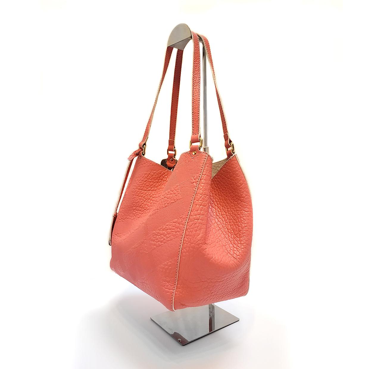 Brand - Burberry
Collection - Canterbury
Estimated Retail - $1,250.00
Style - Tote
Material - Leather
Color - Rose Pink
Pattern - Embossed Check
Closure - Snap
Hardware Material - Goldtone
Model/Date Code - 504*******147
Comes With - Box,