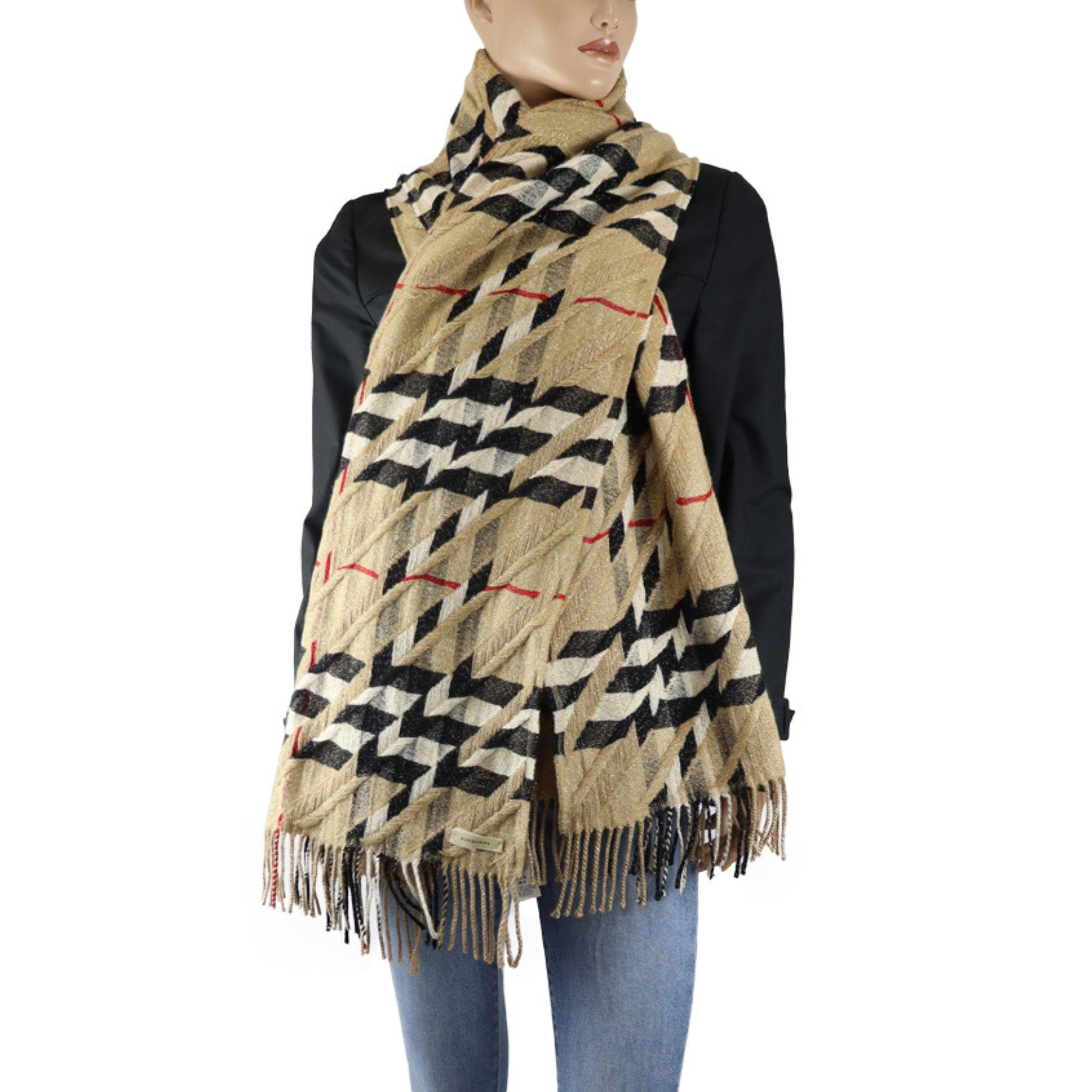 Burberry cashmere haymarket check with shimmery tinsel throughout. Featuring fringe details on the ends.
Measurements: 88cmx88cm
Overall Condition: Very good