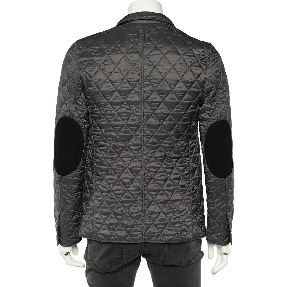 The House of Burberry brings you this stunning jacket to enhance your style. It is designed using charcoal grey quilted synthetic fabric, with contrasting patch details on the elbows. It features buttoned closures, buttoned cuffs, and three pockets.