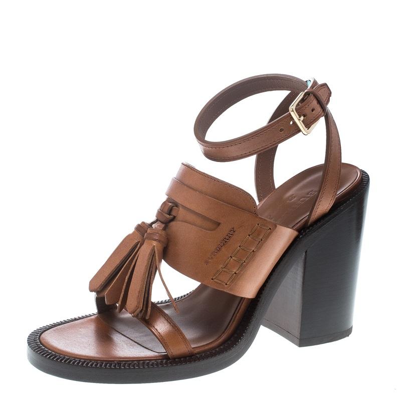 These Bethany sandals from Burberry are edgy and sleek at the same time. They have been crafted from brown leather and designed beautifully with open toes, tassels and 11.5 CM block heels. They are made complete with buckled ankle wraps.

Includes: