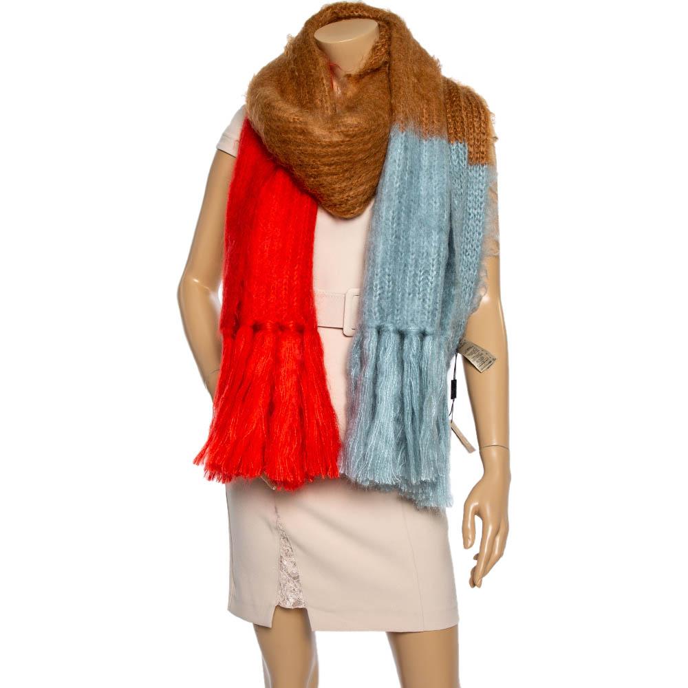 Burberry's scarf is knitted with three distinct panels of bright red, caramel, and light blue. It's crafted from a lightweight and sumptuous blend of mohair and silk and finished with tasseled ends. Wrap it around autumnal weekend ensembles to stay