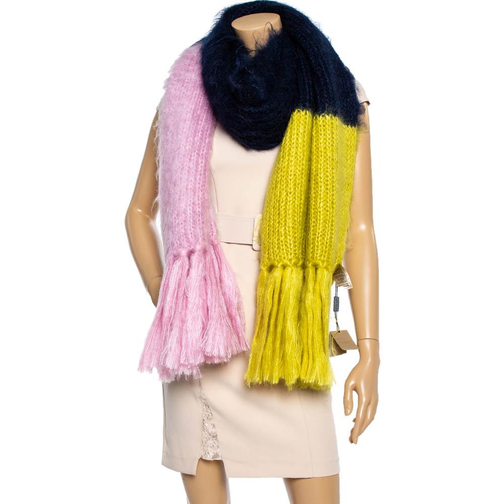 Burberry's scarf is knitted with three distinct panels of warm yellow, pastel pink, and navy. It's crafted from a lightweight and sumptuous blend of mohair and silk and finished with tasseled ends. Wrap it around autumnal weekend ensembles to stay