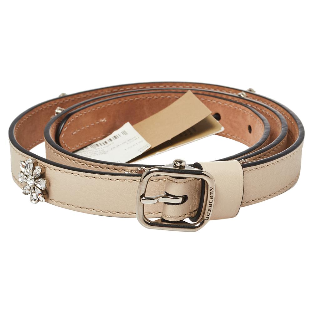 This chic and classy slim belt from Burberry will be an amazing buy! It is crafted from cream leather, adorned with crystal-embellished daisy motifs, and styled with a pin buckle and a single loop that assist in seamlessly fastening it.

Includes: