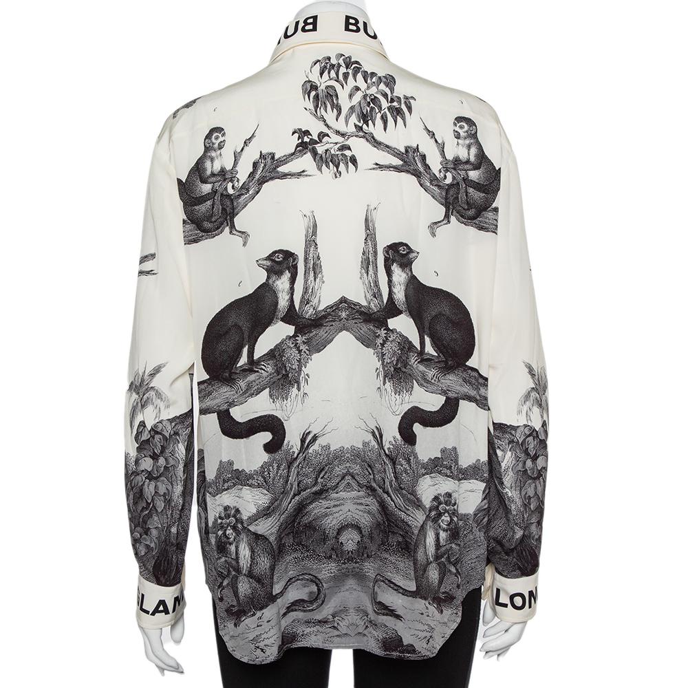 Covered in montage prints, Burberry's silk shirt delivers a comfortable and fashionable style. It features a branded collar, long sleeves with branded cuffs, and front button closure.

