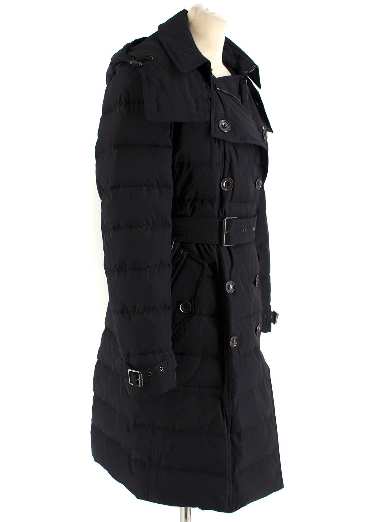 Burberry Detachable Hood Down-filled Puffer Coat

- Black, mid-weight puffer coat
- Down-filled
- Detachable hood
- Double-breasted zip and button fastening
- Front buttoned and zipped welt pockets
- Burberry's signature details: epaulettes,