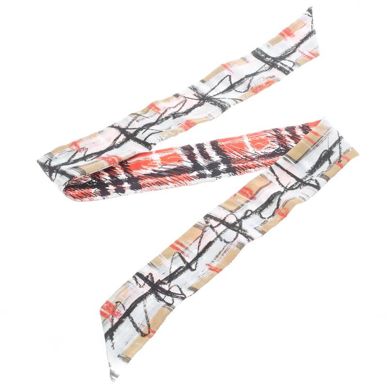 You will have the most stunning party look when you accessorize yourself with this silk scarf from Burberry. This skinny neck piece will make your neck look taller due to its chaotic print of scribble and checks. Its multicoloured design will look