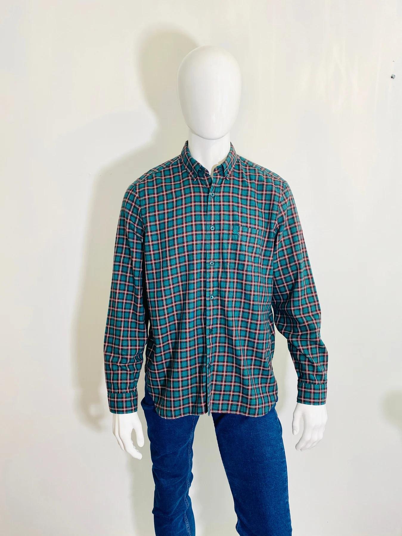 Burberry England Plaid Shirt

Cotton, long sleeve with button cuffs in green, red, white and black. Button down collar and closure with Burberry logo buttons. Burberry embroidered logo to the chest pocket.

Additional information:
Size –