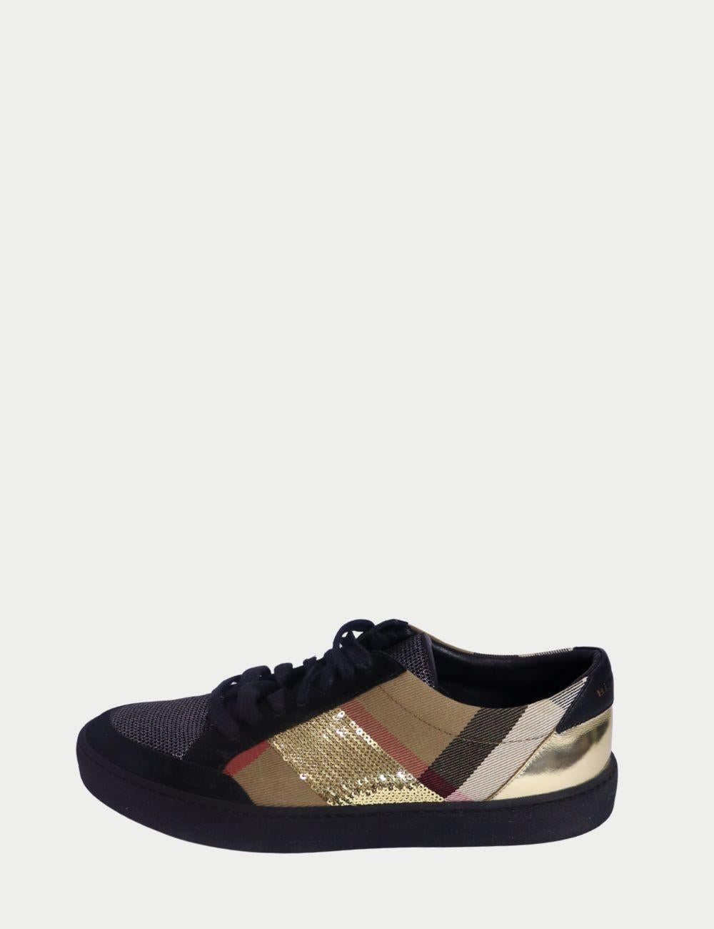 Burberry Check Low-Top Sneakers with Black Suede and Metallic Detail

Step up your sneaker game with these eye-catching Burberry Check Low-Top Sneakers. Featuring the brand’s iconic vintage check canvas with a modern twist, these kicks combine black
