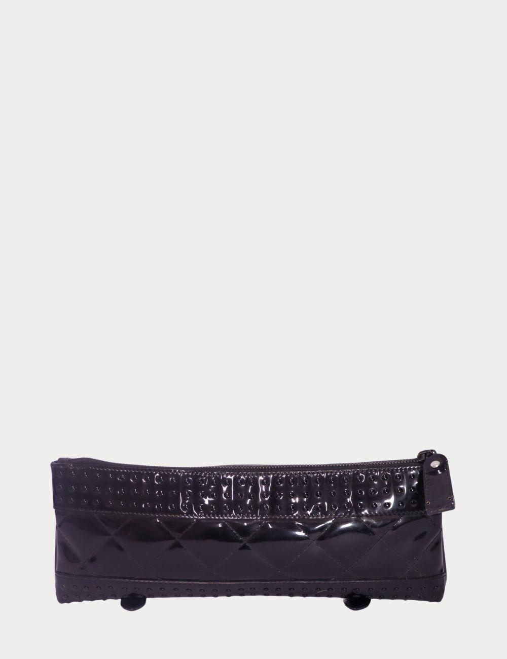 Burberry Black Patent Leather Quilted Clutch

Add a touch of glossy drama to your evening ensemble with this Burberry Black Patent Leather Clutch. Featuring quilted detailing, studded accents, and a sleek silhouette, this clutch is the epitome of