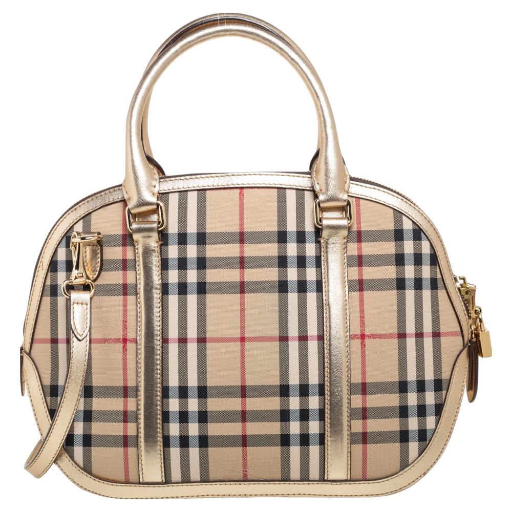 Finely crafted and richly designed, this Burberry piece is surely a must-have in every woman's collection. It is made from Haymarket Check nylon as well as leather and features two handles and a spacious fabric interior. Ideal for any day, this bag