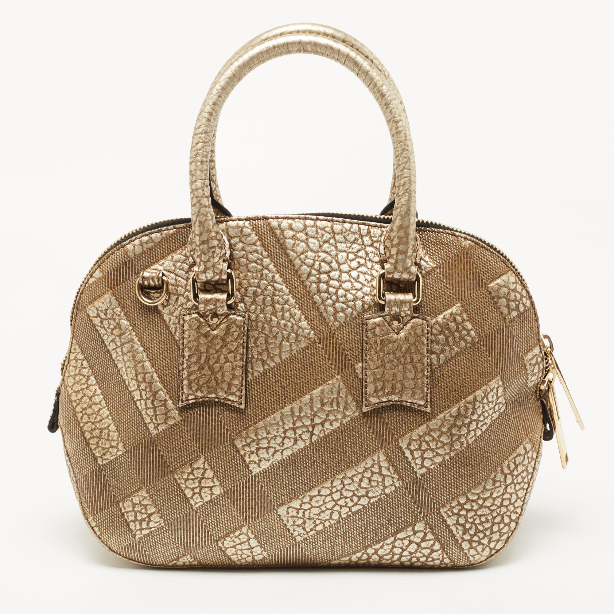 Expertly crafted and skillfully designed, this Burberry creation is a must-have in every bag collection. It is made from check-embossed leather. Features like the two comfortable handles, detachable shoulder strap, and spacious interior make it a