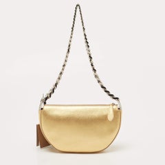 Burberry Borsa mini Olympia con zip e catena in pelle dorata