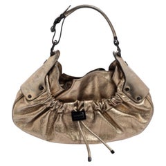 Burberry hobo guerrier à cordon de serrage en cuir doré