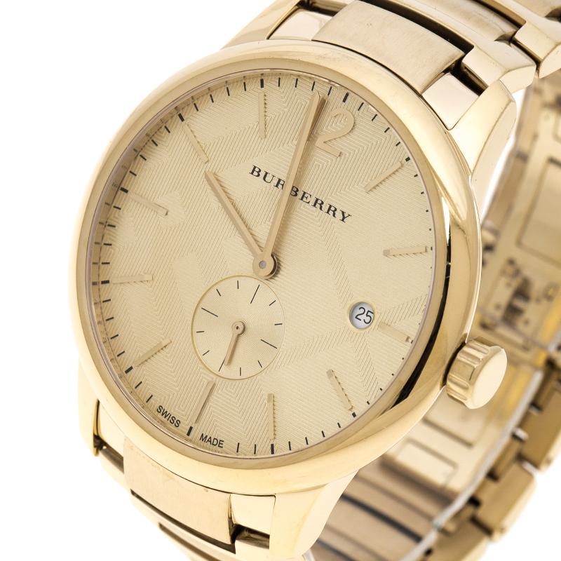 Be a proud owner of this magnificent Swiss made creation from Burberry that has been made from gold-plated stainless steel and it comes with a yellow analogue dial flaunting index hour markers. It follows a quartz movement, keeping perfect time. The