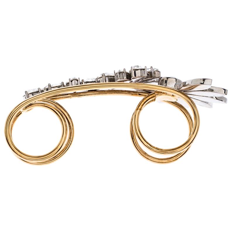 Presenting a vision of wearing a glamorous ring of luxury on your finger is this creation from Burberry. Made excellently from gold-tone metal, the creation comes as a set of two attached rings blooming with crystal-embellished daisies. It is bound