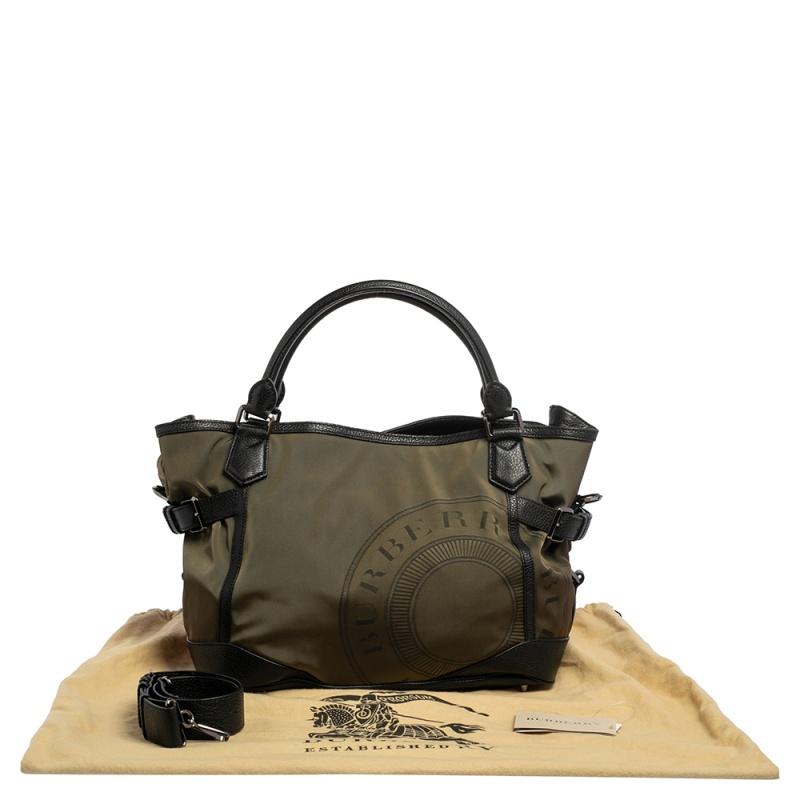 Here is a very functional and practical Montclare Burberry tote! It is big enough to carry your day's worth of belongings, laptop, and documents. It comes with a removable strap, zipped pocket, and has an inside partition. The nylon and leather