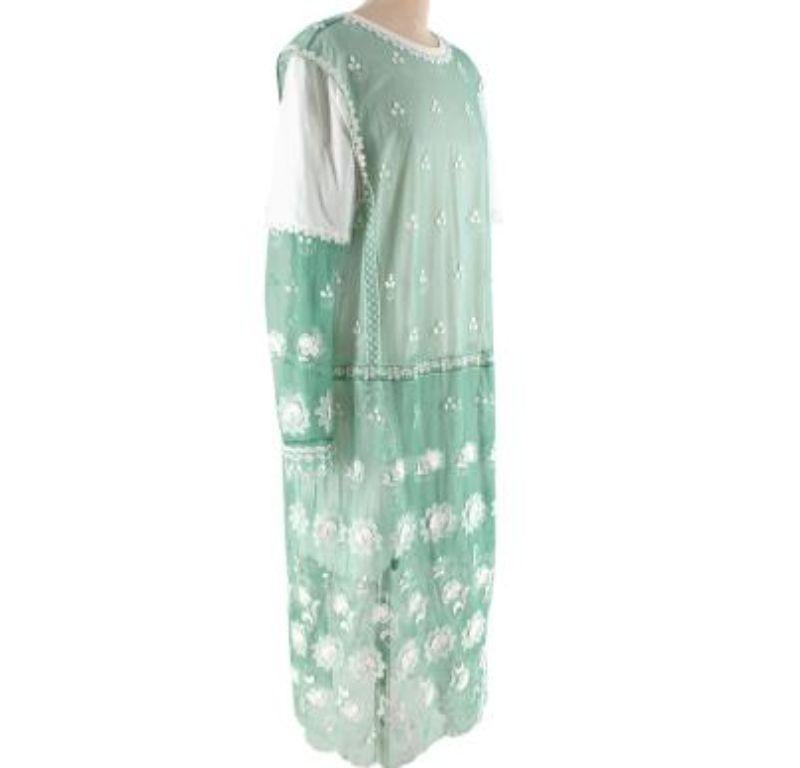 Burberry Green Embroidered Tulle & Jersey Dress

- Hybrid dress featuring panels of floral applique mint green tulle, contrasted with white cotton jersey
- Round neck, long sleeve
- Concealed zip back
-Fully lined
-Relaxed fit 

Materials:
89%