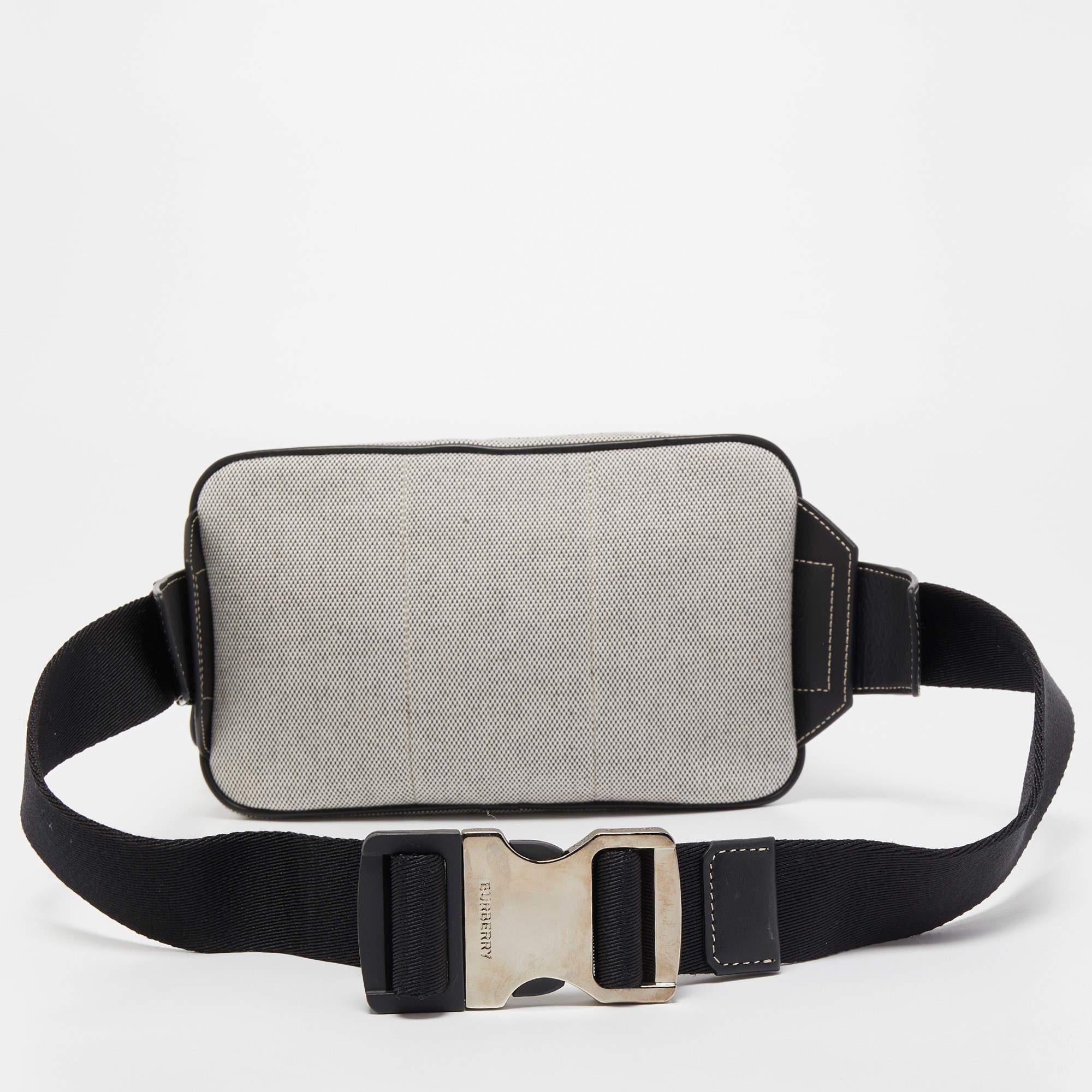 This West belt bag from the House of Burberry will help you obtain a comfortable and classy style! Designed using leather and canvas, this bag showcases silver-tone fittings with a spacious interior. Carry your belongings stylishly in this smart