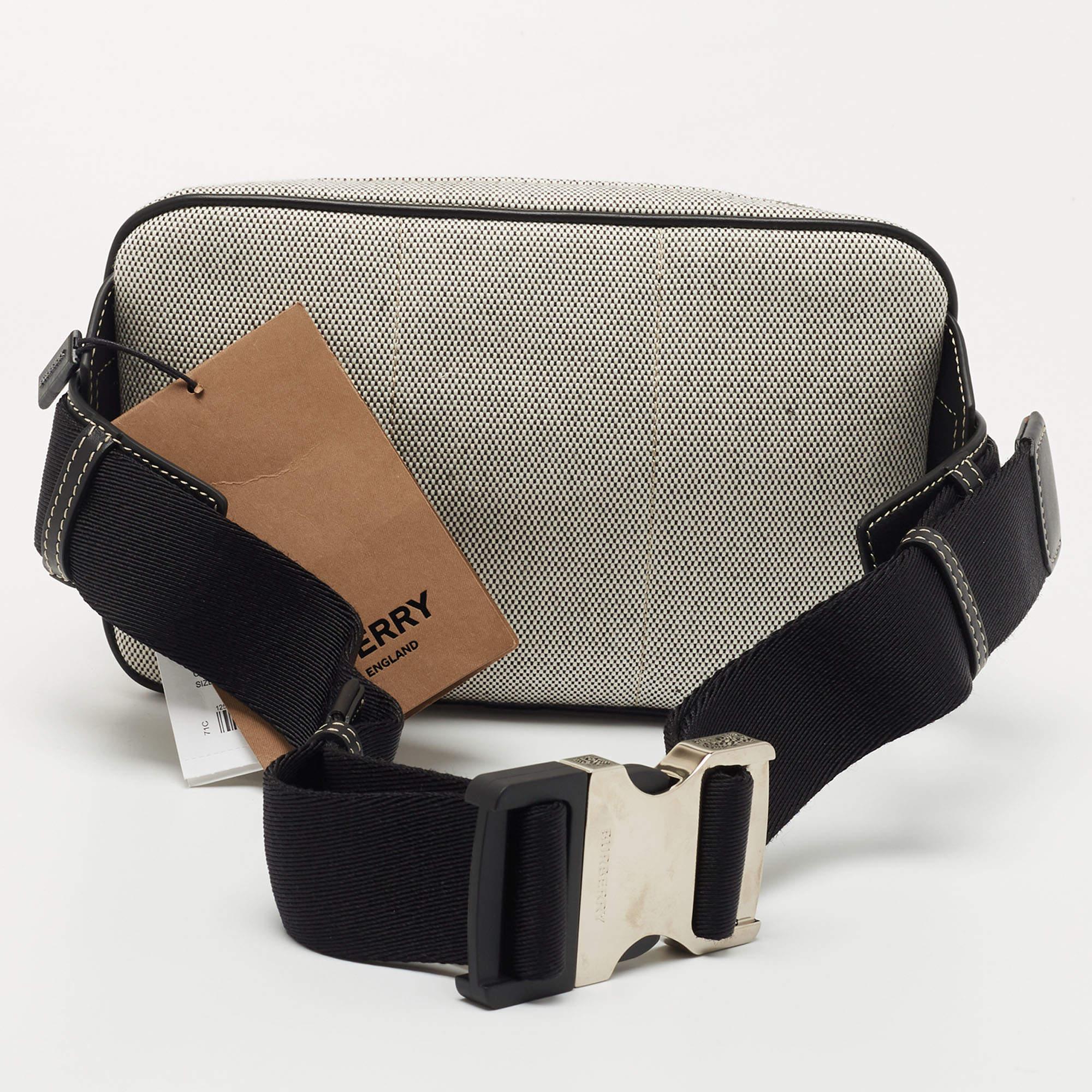 This West belt bag from the House of Burberry will help you obtain a comfortable and classy style! Designed using leather and canvas, this bag showcases silver-tone fittings with a spacious interior. Carry your belongings stylishly in this smart