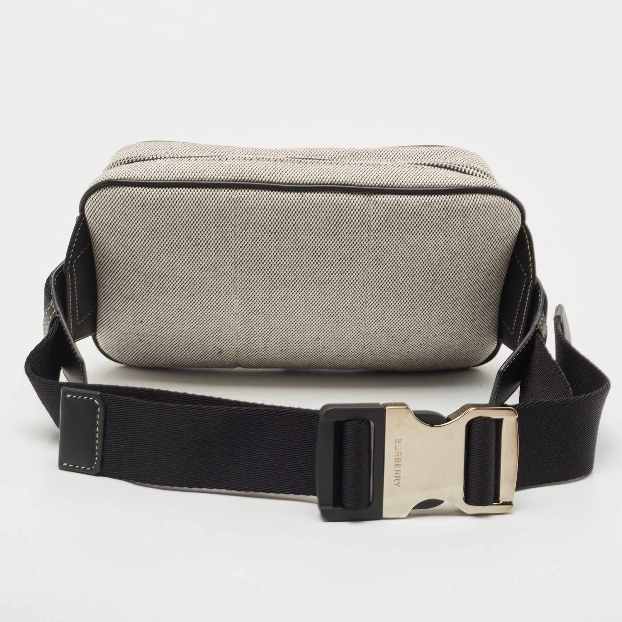 This bum bag from Burberry brings a practical and modish take to your attire. It is tailored using black nylon and leather with a contrast logo print decorating the front. This bum bag is equipped with zipped pockets that lead to the canvas-lined
