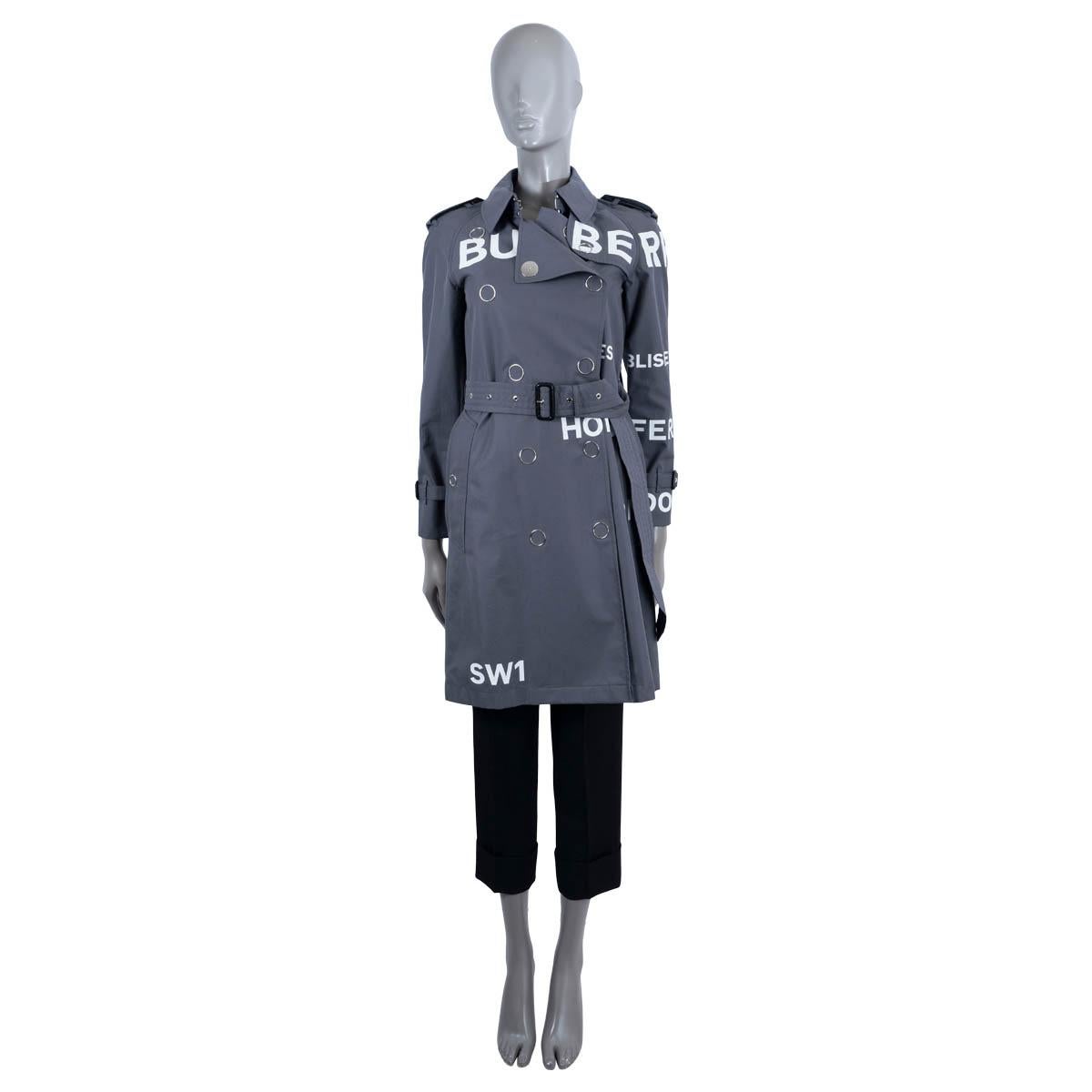 100% authentic Burberry Wharfbridge trench coat in grey cotton (100%) with horseferry print in white. Features epaulettes on the shoulders and cuffs.  Closes on the front with silver tone push buttons and a matching belt. Lined in cotton (100%). Has