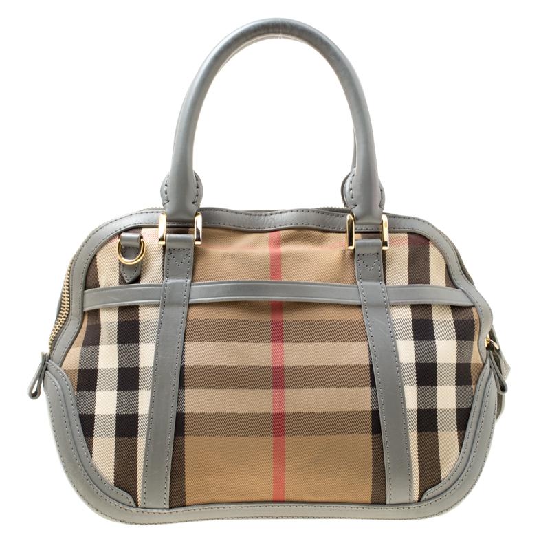 Finely crafted and richly designed, this Burberry piece is surely a must have in every woman's collection. It is made from House Check fabric as well as grey leather and features two handles and a spacious canvas interior. Quintessential for a day