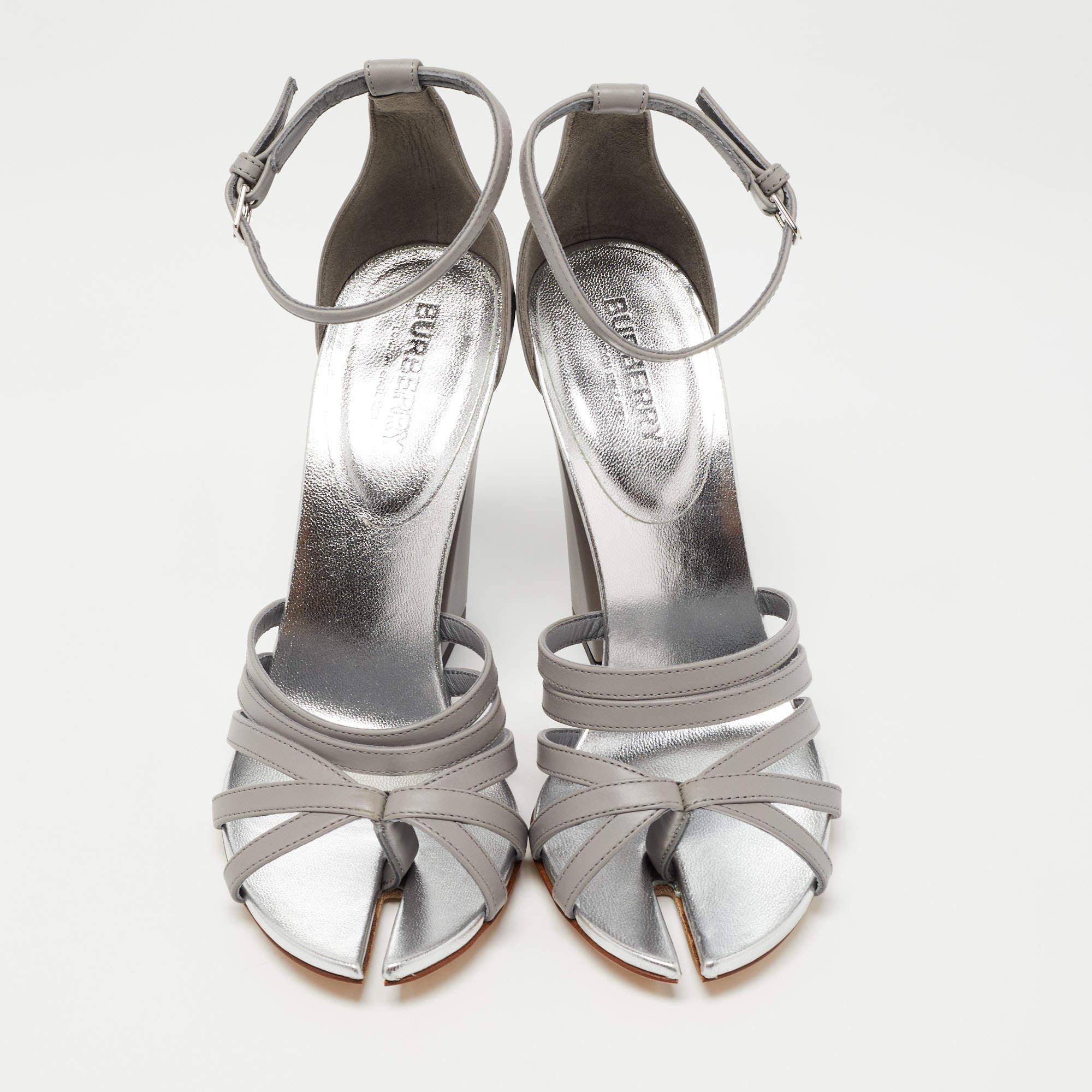 These sandals from Burberry are edgy and sleek at the same time. They have been crafted from leather and designed beautifully with cutouts on the toes, leather lining, strappy vamps, and block heels. They are made complete with buckled ankle strap