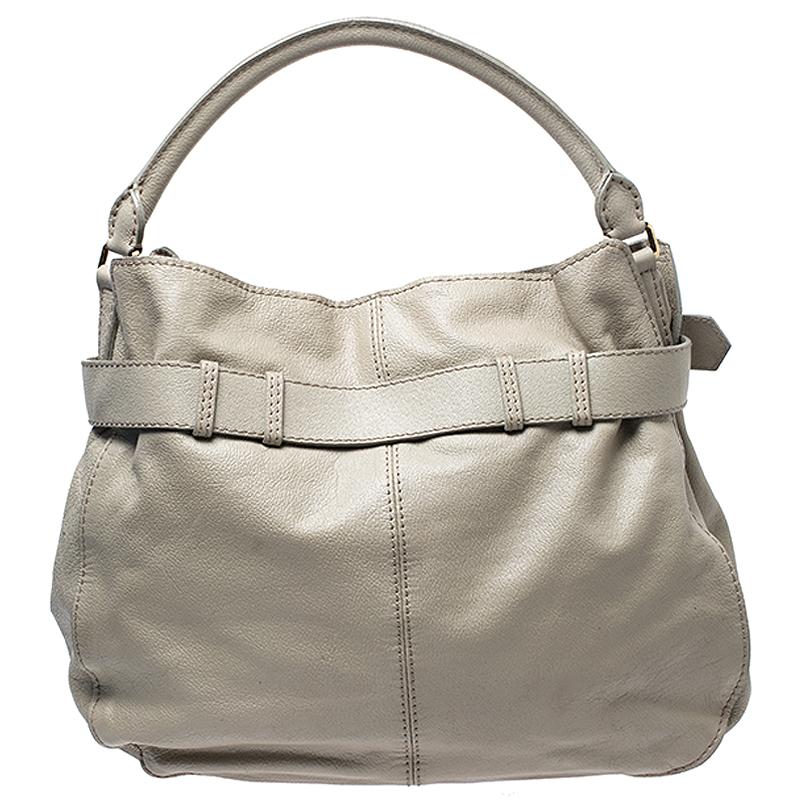 This soft, slouchy hobo bag from Burberry is in grey leather and finished with a wide band around the top. This is finished with a press-lock Burberry medallion in gold-tone. The interior is lined with the iconic Burberry check nylon. The single