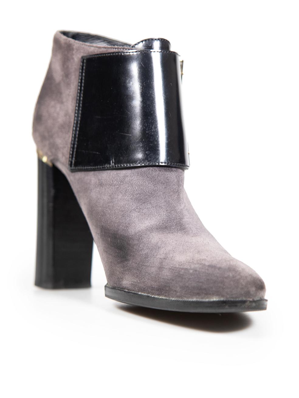 CONDITION is Very good. Minimal wear to the boots is evident. Abrasion to the toe box, counter and leather strap detailing to both shoes. Scratching to the heels on both shoes. Wear to the heel tips and replaced soles on both shoes onfthis used