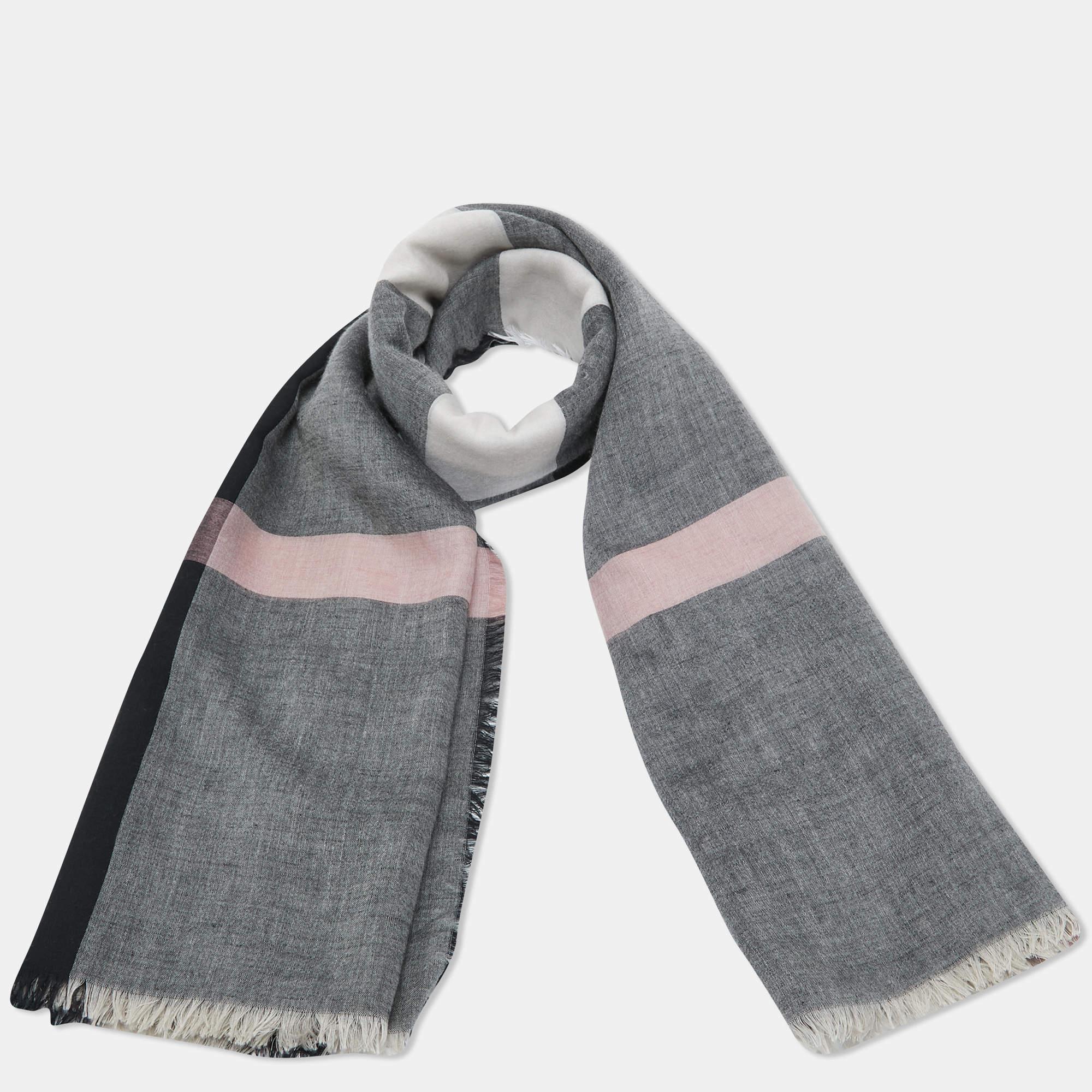 This lovely scarf is a fun way to accessorize your casual outfits and statement totes. This scarf from Burberry features an interesting design. It is cut from smooth fabric and will elevate all your looks.

Includes: Brand Tag