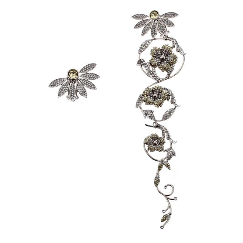Mismatched, sparkly and breathtaking! These asymmetric earrings from Burberry tugs at one's heartstrings in the most profound way. Sculpted from silver-tone metal and lit by crystals, the pair comes as stud flowers but one of them has an exaggerated