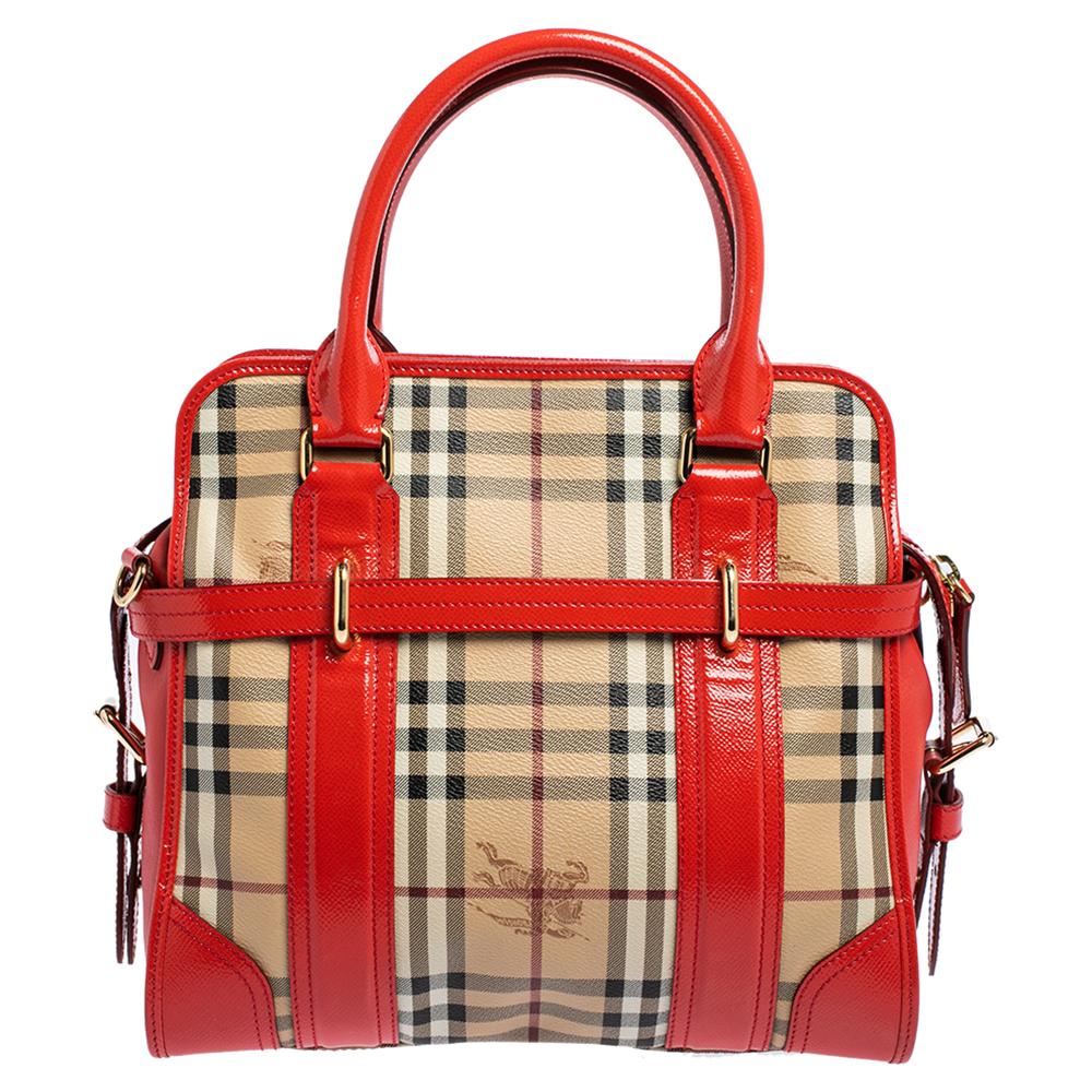 Experience the touch of the best design and an aura of regality with this immaculately stitched Burberry Minford satchel. It has been crafted from coated canvas in the signature Haymarket check and patent leather trims. The bag features dual top