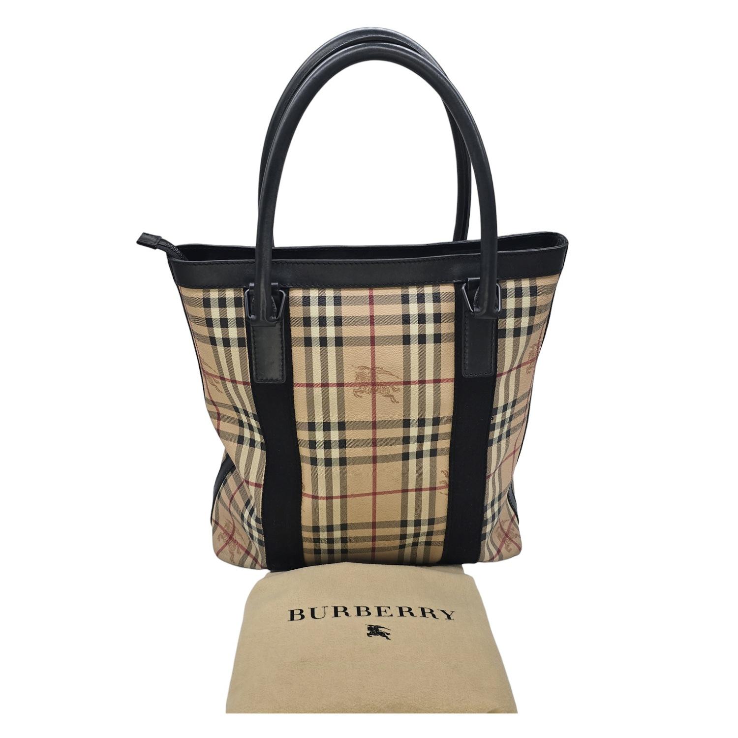 Introducing the Burberry Haymarket Check Coated Canvas Tote. This exquisite tote boasts a sophisticated Beige color with a multicolor check pattern and Leather trim, evoking a sense of elegance and exclusivity. The roomy fabric interior with