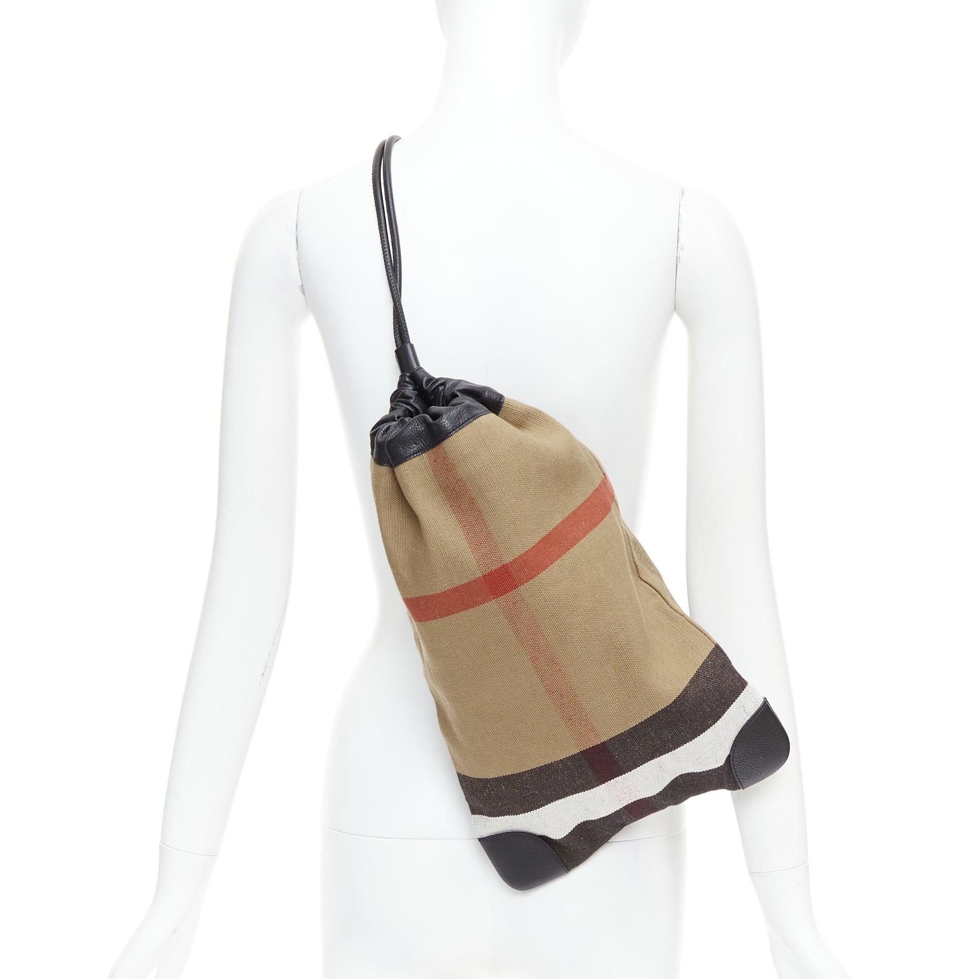 BURBERRY House Check cotton canvas leather trim sling backpack
Reference: SNKO/A00512
Brand: Burberry
Material: Leather, Cotton, Jute
Color: Brown, Black
Pattern: Checkered
Closure: Drawstring
Lining: Black Fabric
Made in:
