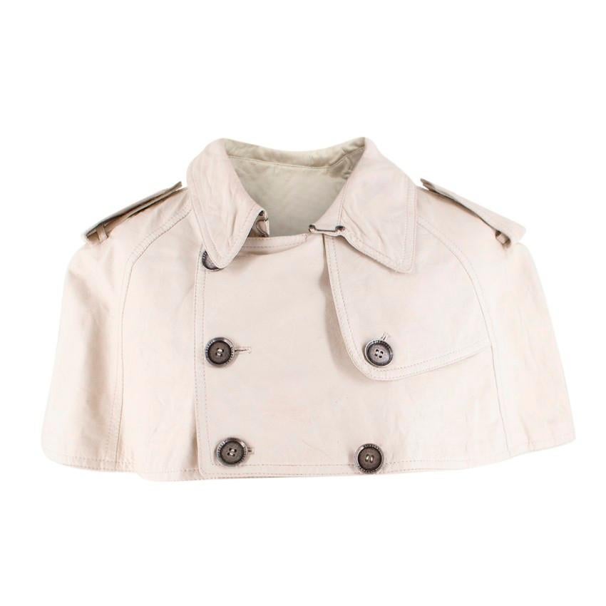 Burberry ivory cropped leather cape

- Ivory leather
- Cropped cape
- Trench coat style double breasted buttoning with antique silver-tone metal embossed buttons
- Epaulettes
- Buckle detail at the back of the neck
- Lined

Please note, these items