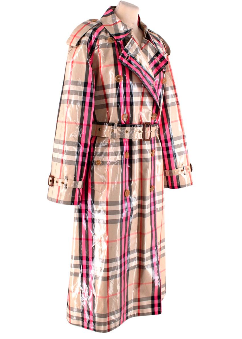 Burberry Laminated Neon Pink House Check Trench Coat
 

 - Signature trench coat given a high-fashion spin via a lamiated, high-shine coating, and a flash of neon pink, being added to the House check
 -Notched collar with a double-breasted button
