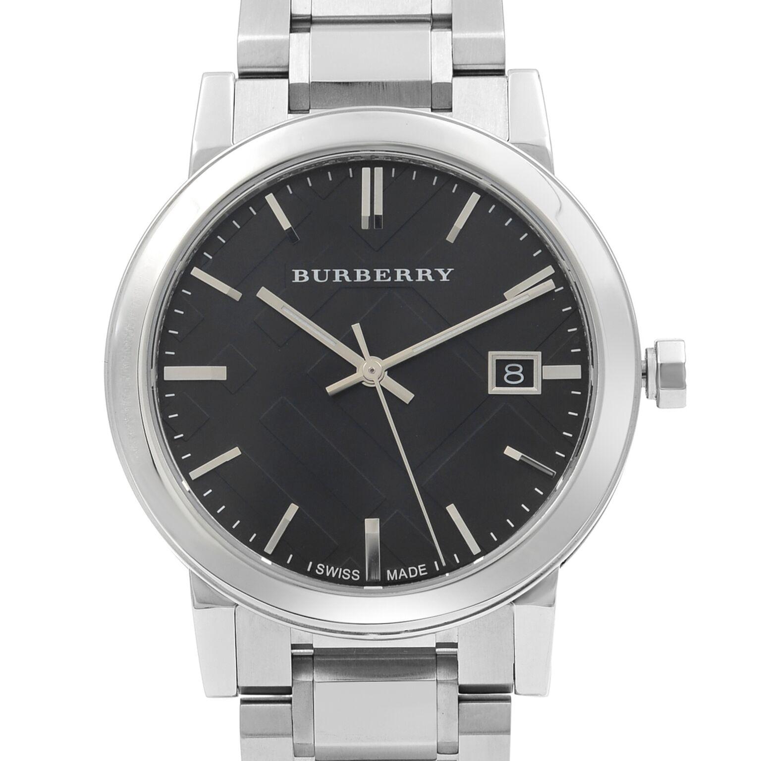 This pre-owned mint condition Burberry Large Check BU9001 is a beautiful men's timepiece that is powered by quartz (battery) movement which is cased in a stainless steel case. It has a round shape face, date indicator dial and has hand sticks style