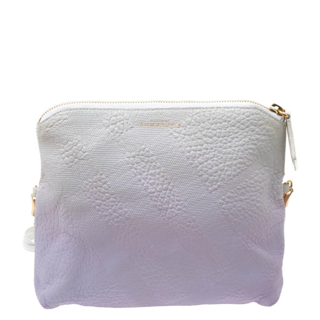This crossbody bag from Burberry is crafted from lavender and white hued leather. The bag features a checked pattern all over the foldover silhouette, an adjustable shoulder strap and a nylon-lined interior that houses a zip pocket. This creation is