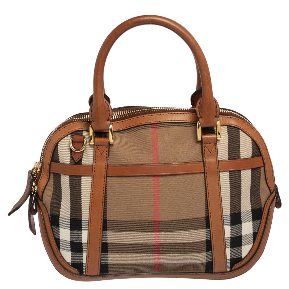 Taking inspiration from vintage luggage, Burberry's Orchard bowling bag is crafted from leather & Birdie House Check canvas and is ideal for everyday use. This bag features gold-tone hardware and the double-rolled handles make this bag convenient to