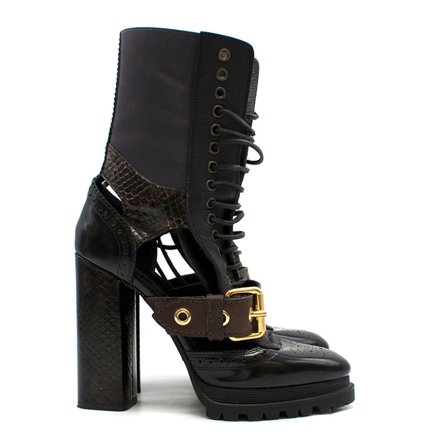Burberry Lace up Snake Skin Block Heel Boots

-Black leather, mid weight
-Brown snake print detail on heel and near ankle
-Brown leather and gold 
hardware buckle 
-Purple mid-calf stretchy panels
-Rubber soles
-Black leather lace up