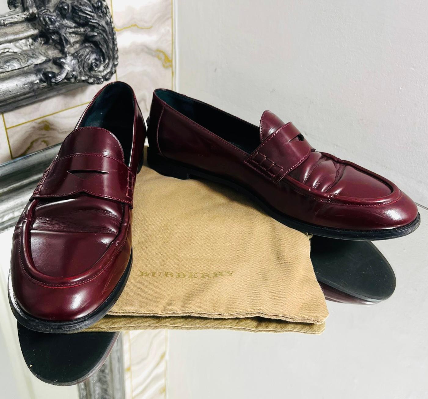 Burberry Leather Loafers

Burgundy, slip-on loafers designed with almond toe.

Detailed with gold 'Burberry' engraved plaque to the heel and tonal stitching.

Featuring leather soles, insoles, and lining.

Size – 38

Condition – Good (Light