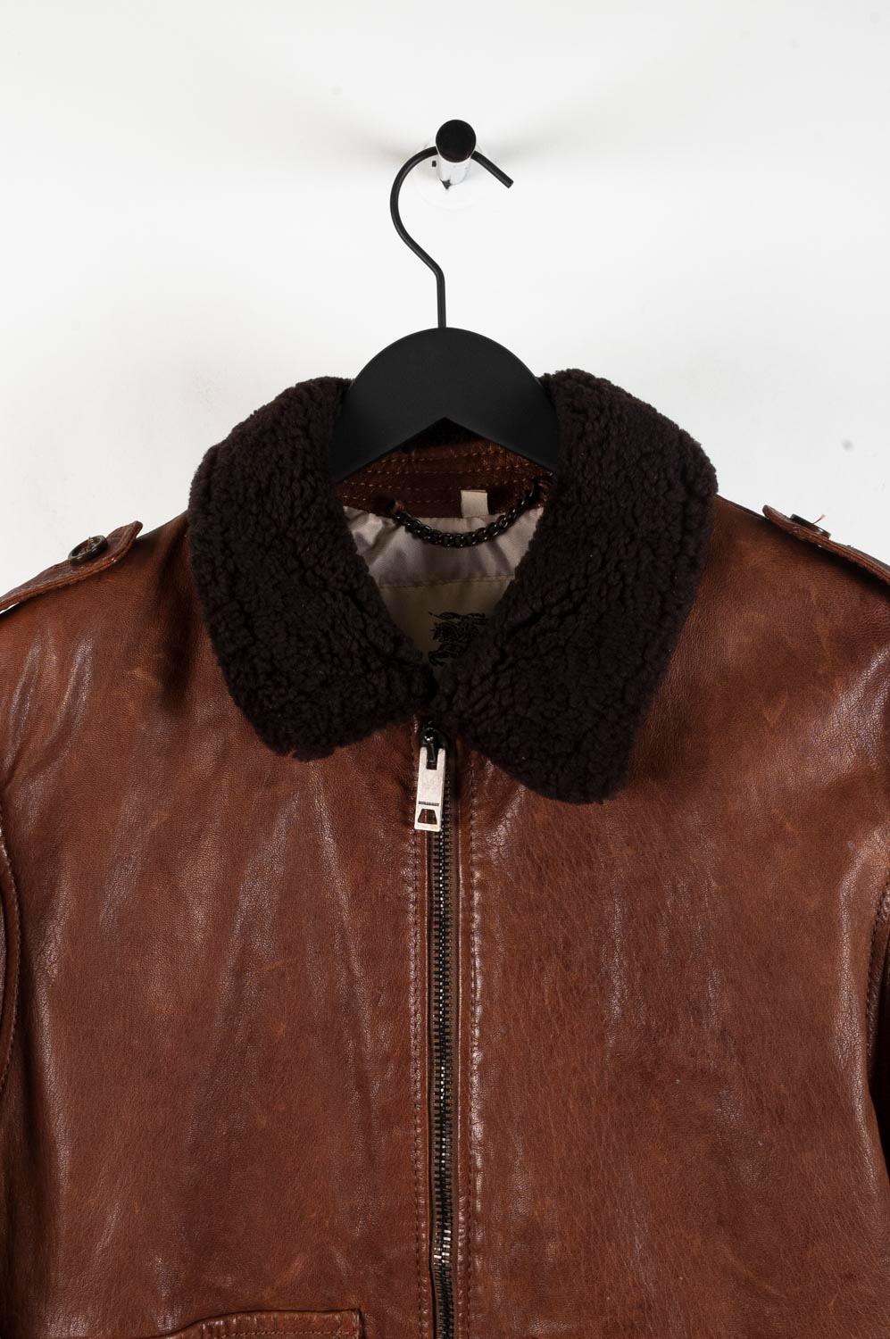 Item for sale is 100% genuine Burberry London Leather Men Jacket, S448
Color: Brown
Material: 100% lamb skin, shearling collar
Tag size: 52R (Large) 
This jacket is great quality item. Rate 8 of 10, good used condition, leather has some wear and