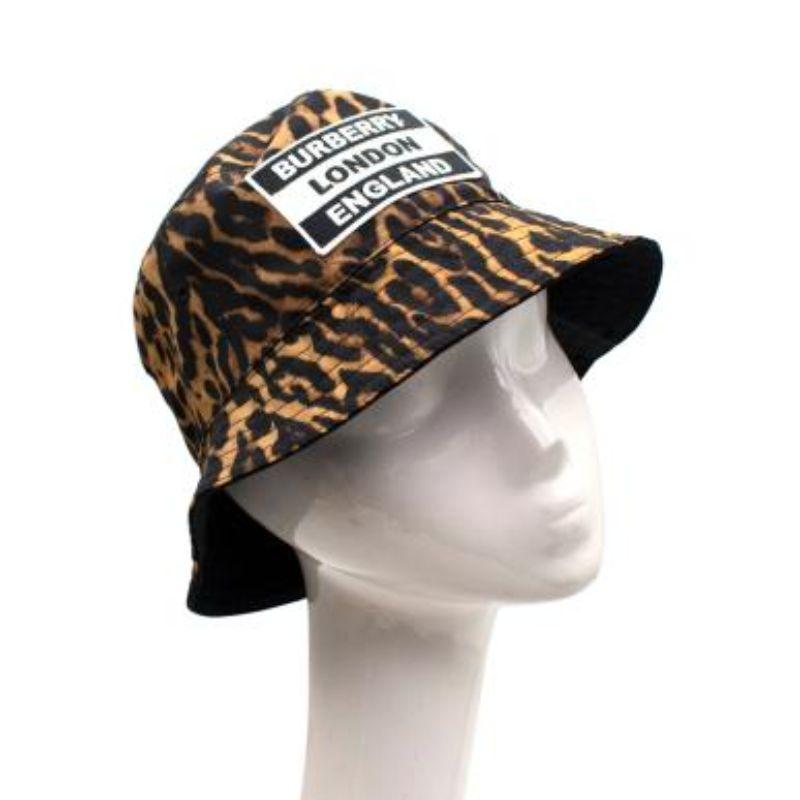 Burberry Leopard Print Bucket Hat

- Small brim with topstitching
- Leopard print body
- Logo embroidery on front
- Fully lined

Material
100% Nylon

Made in Italy

PLEASE NOTE, THESE ITEMS ARE PRE-OWNED AND MAY SHOW SIGNS OF BEING STORED EVEN WHEN