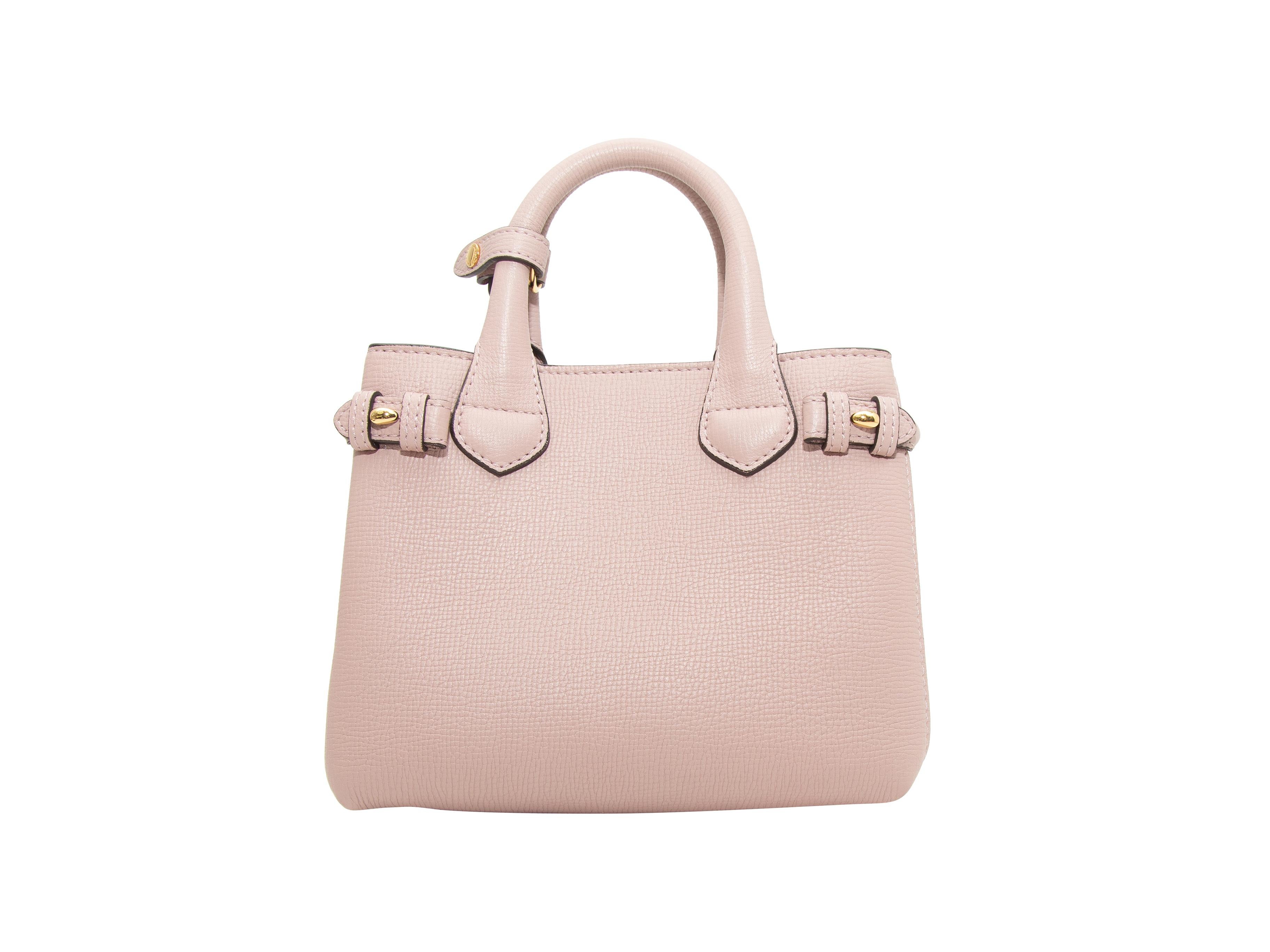 Product details: Light mauve and multicolor leather Baby Banner Tote by Burberry. Gold-tone hardware. Dual rolled top handles. Nova Check detailing at sides. Optional shoulder strap. Magnetic top closure. 8