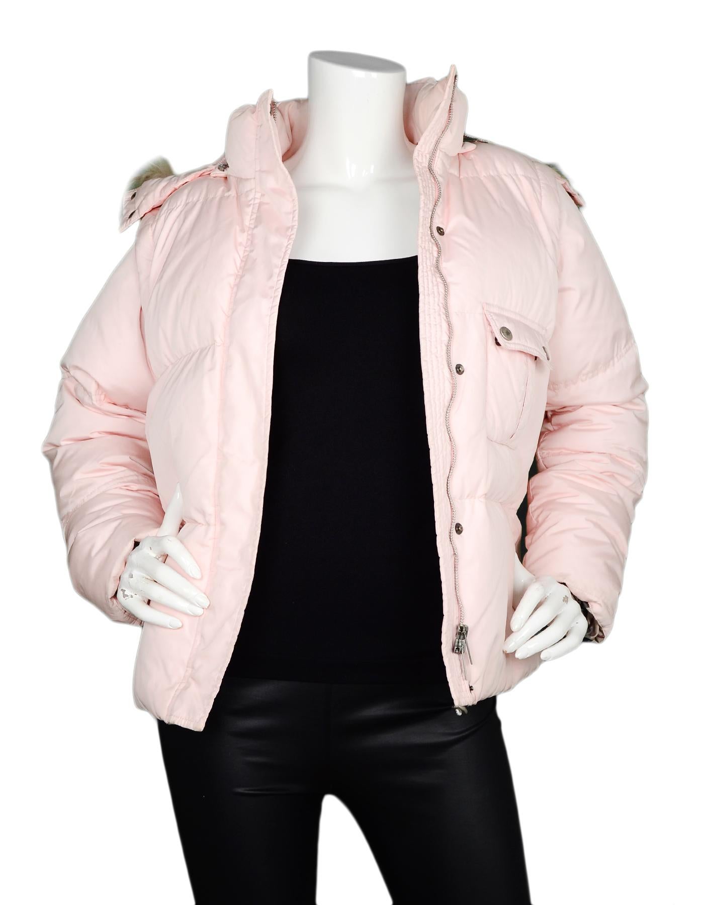 Burberry Light Pink Puffer Coat W/ Removable Fur Trim Hood & Sleeves (Into Vest) Sz M

Made In: China
Color: Light pink
Materials: 97% nylon, 3% polyurethane
Lining: 100% polyester
Opening/Closure: Zip and snap button front
Overall Condition: