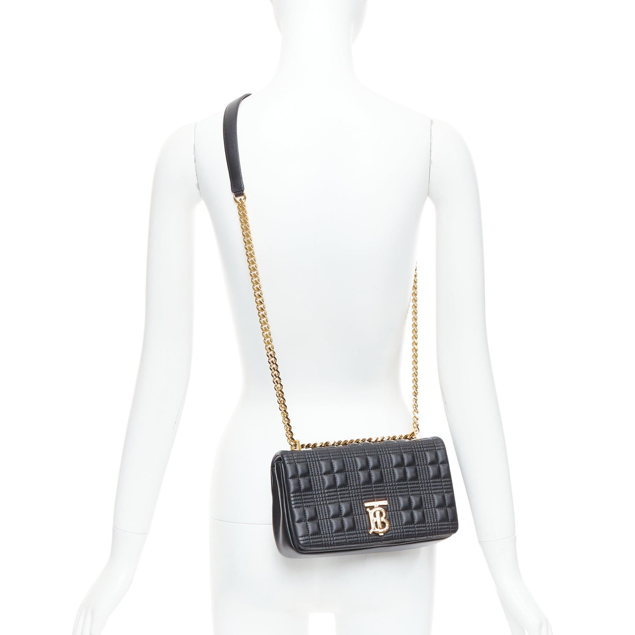 BURBERRY Lola black quilted leather gold TB logo crossbody bag
Reference: BNAY/A00003
Brand: Burberry
Model: Lola
Material: Leather
Color: Black, Gold
Pattern: Solid
Closure: Snap Buttons
Lining: Black Fabric
Extra Details: A crossbody bag made in