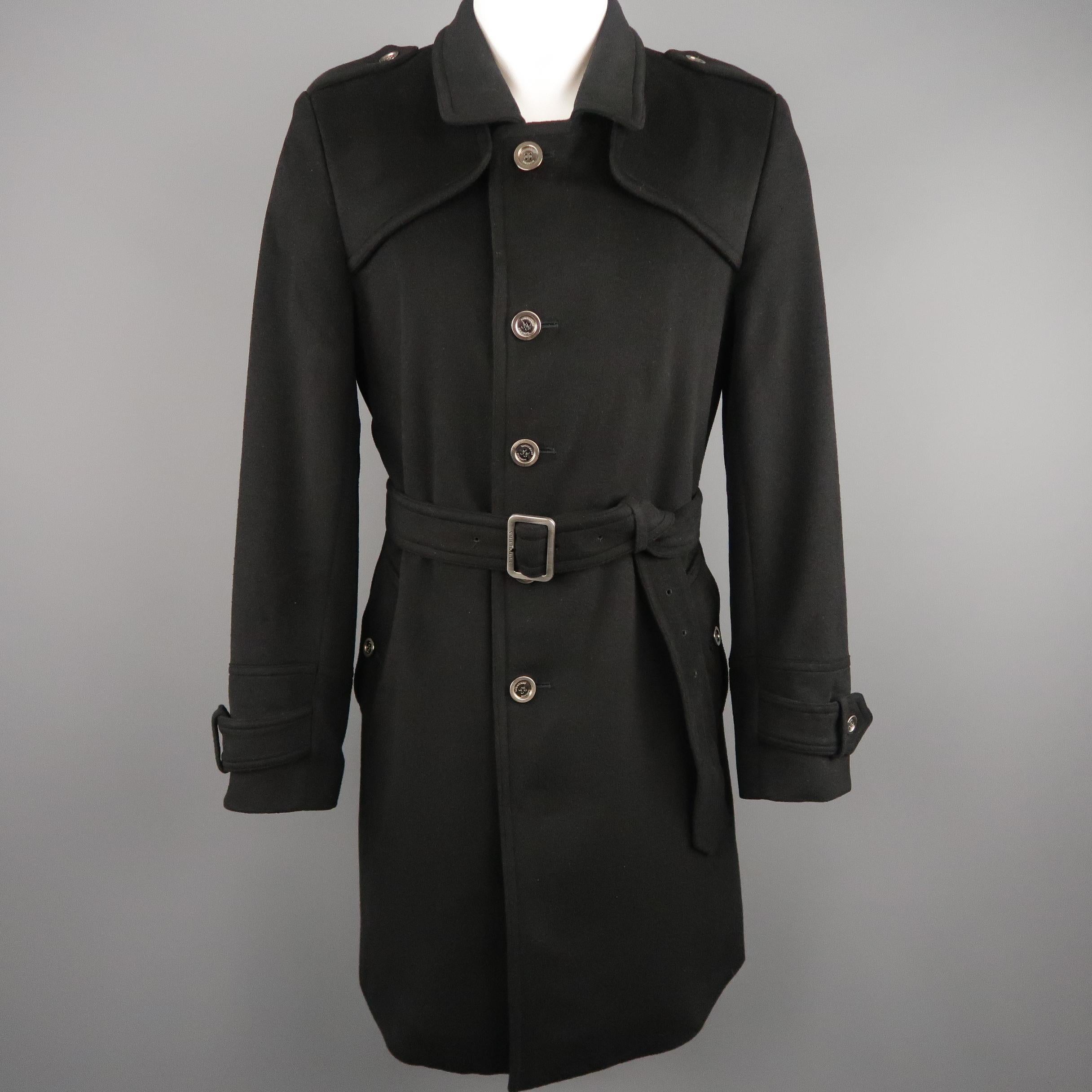 BURBERRY LONDON Trenchcoat comes in a black tone in a solid wool blend material, with epaulettes, a notch lapel, 5 buttons closure, single breasted, slit pockets, belted cuffs and single vent at back, belted. Made in England.
 
Excellent Pre-Owned